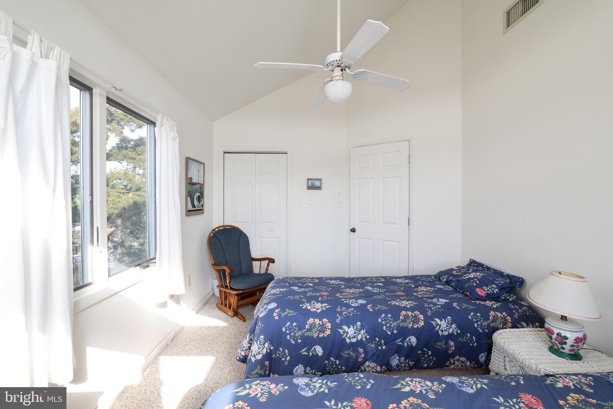 24 Maiden Lane Harvey Cedars, NJ 08008 - Photo 29 of 37 a bedroom with a bed and window