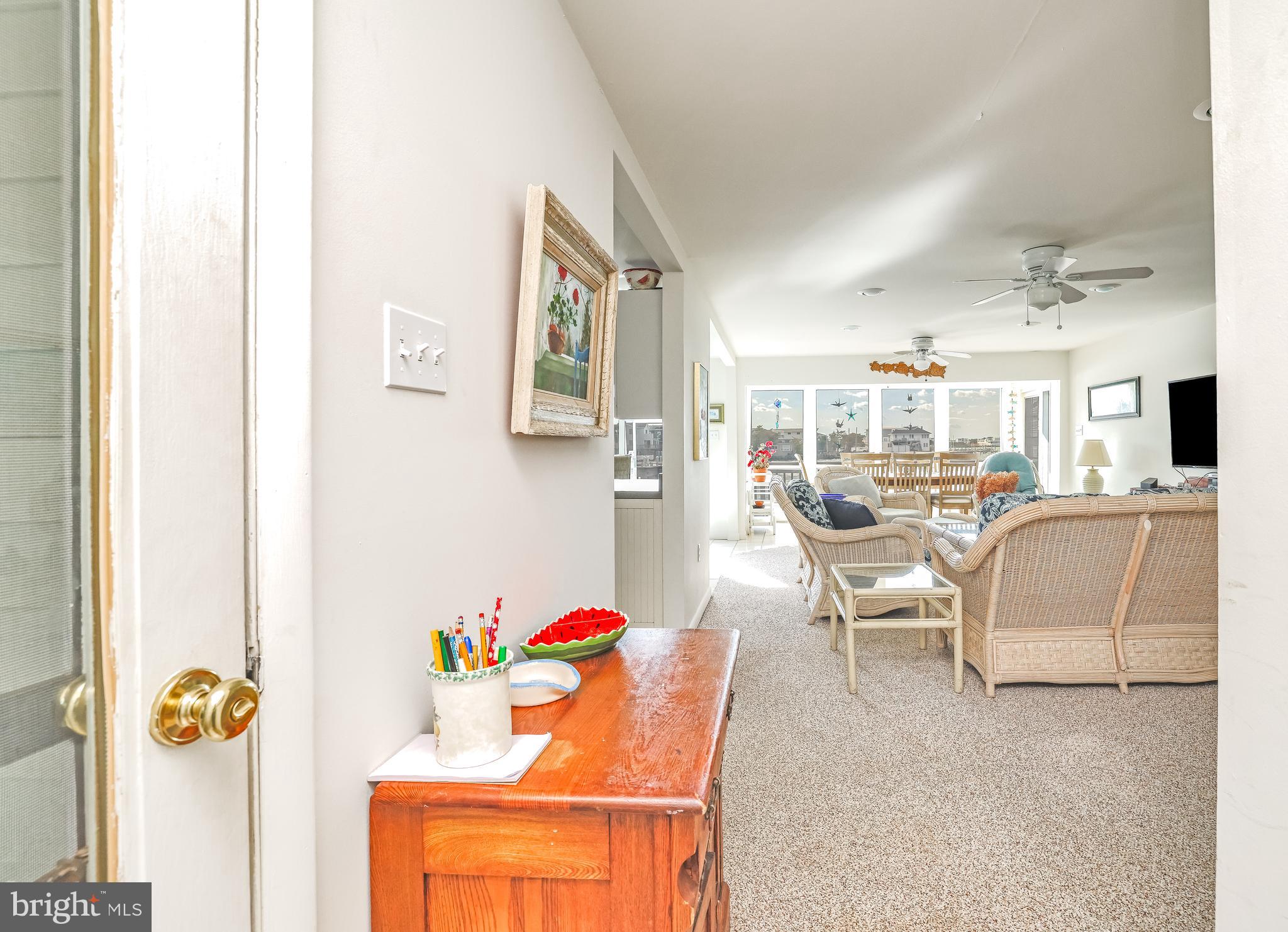 24 Maiden Lane Harvey Cedars, NJ 08008 - Photo 6 of 37 a living room with furniture and a table