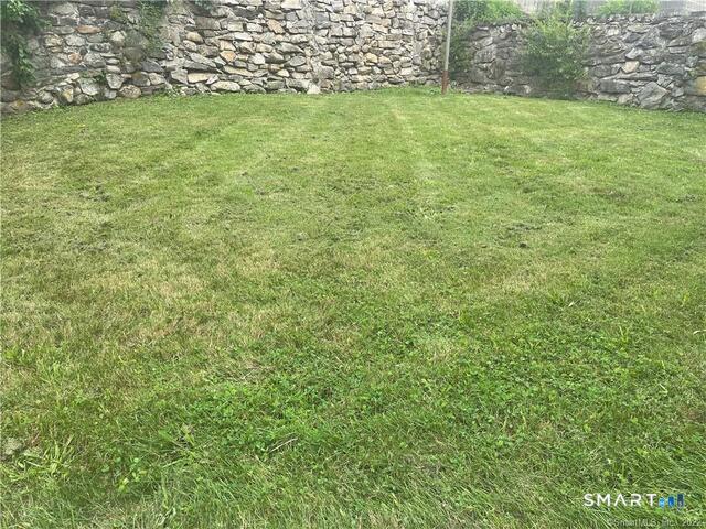 61 8th Street Derby, CT 06418 - Photo 4 of 12 a view of a yard with an outdoor space
