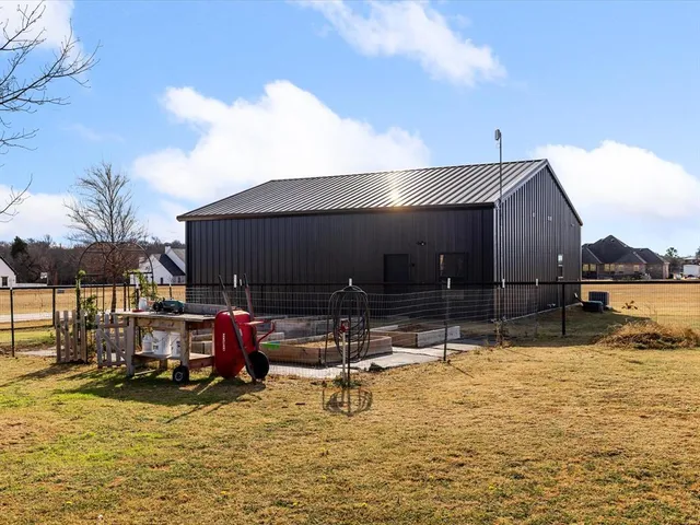 a swimming pool with outdoor seating yard and barbeque oven