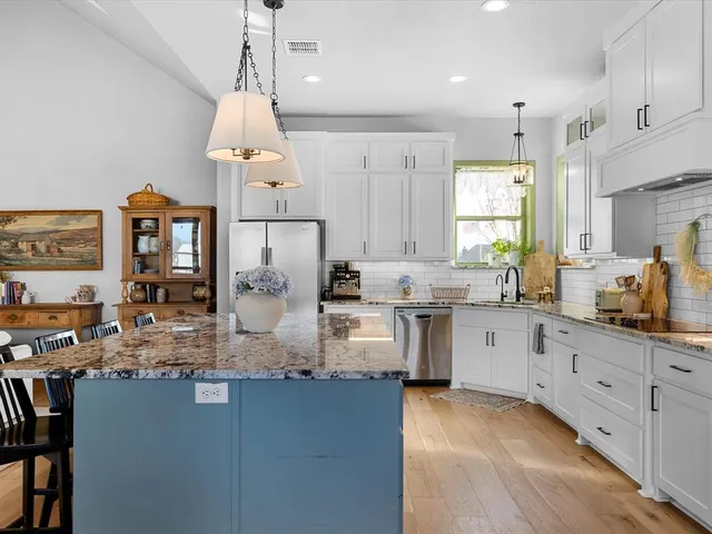 a kitchen with sink cabinets and window