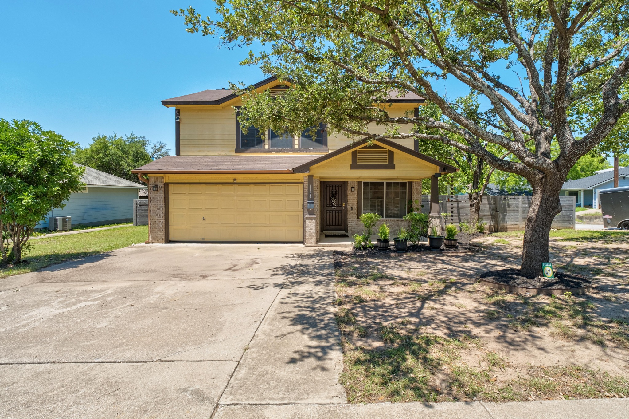 1184 Waller Street Austin, TX 78702 - Photo 1 of 19 a front view of a house with garden
