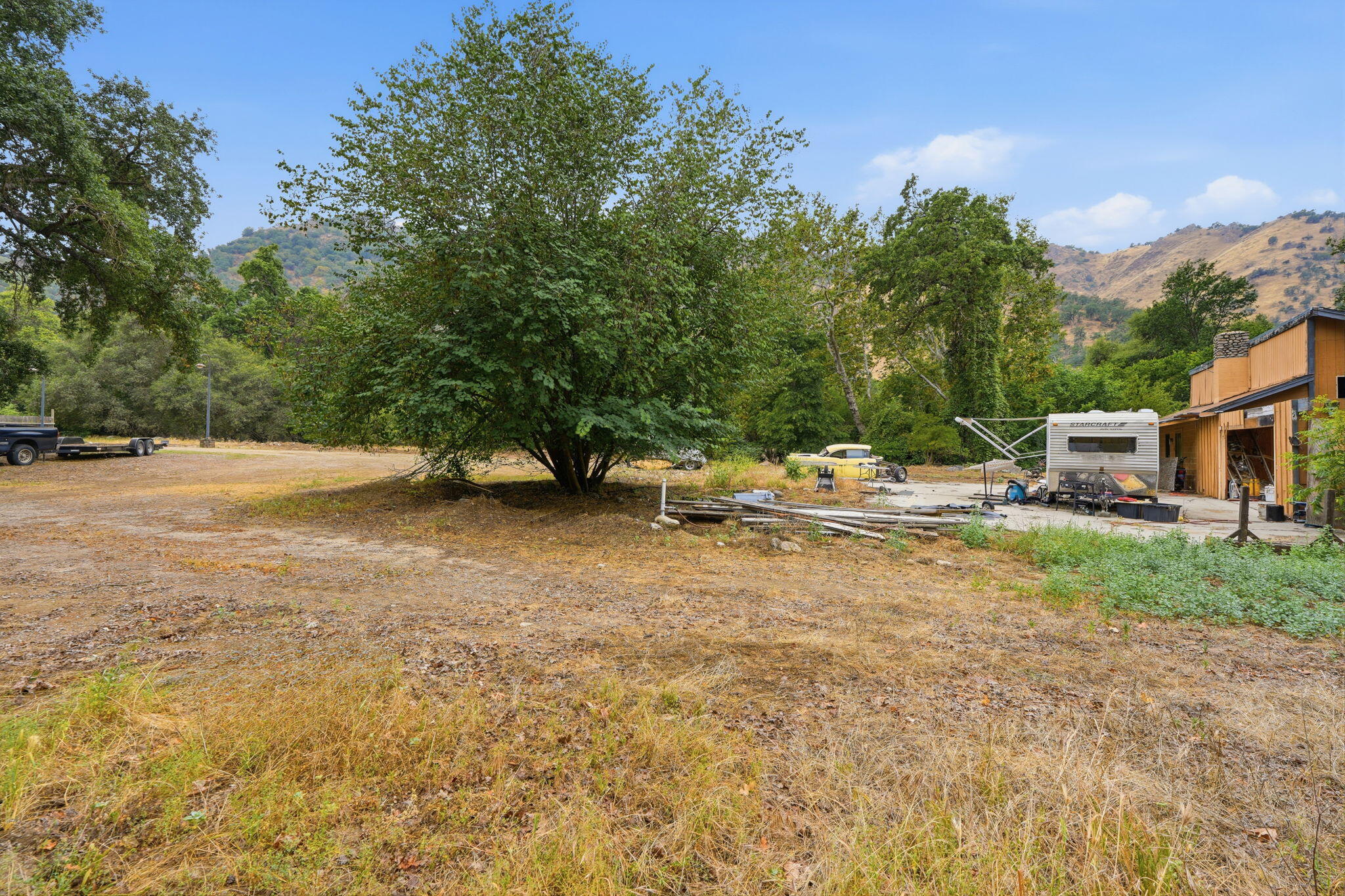 44065 South Fork Drive Three Rivers, CA 93271 - Photo 20 of 33 a backyard of a house with table and chairs