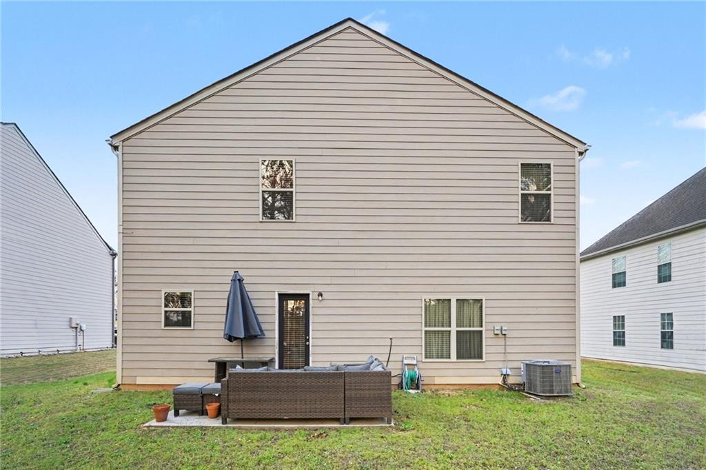 1241 England Terrace Hampton, GA 30228 - Photo 20 of 20 a front view of a house with a yard