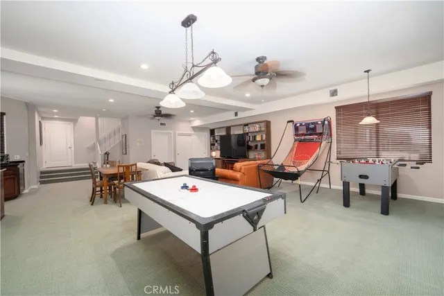 a view of a dining area with furniture and a chandelier