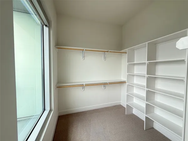 a view of an empty walk in closet