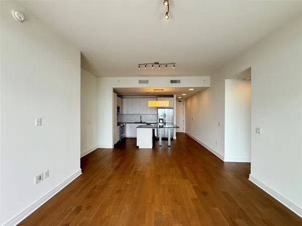 a view of kitchen with furniture and wooden floor