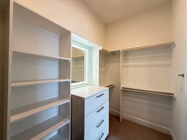 a view of an empty walk in closet