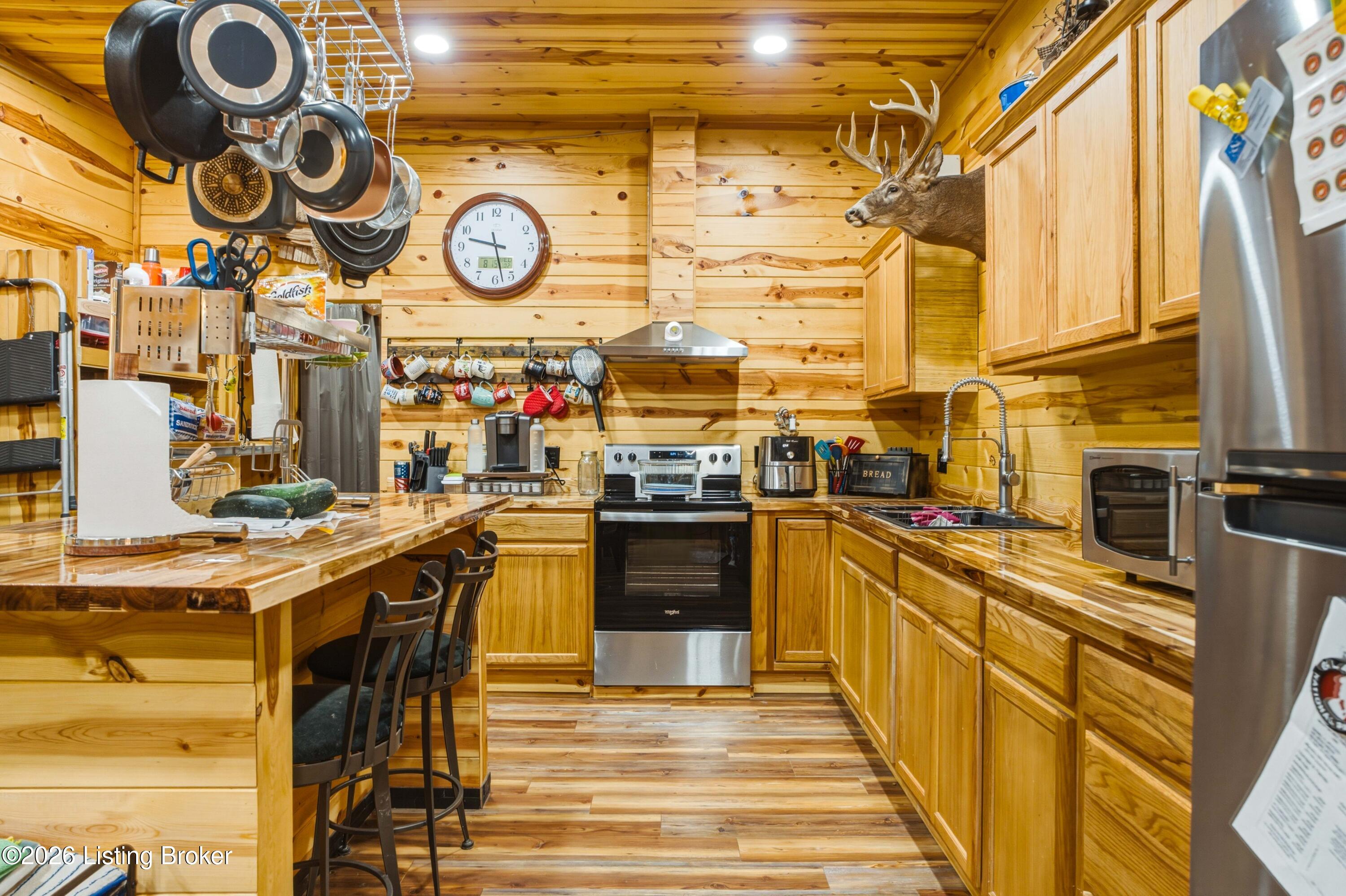 295 Bray Ridge Road Bedford, KY 40006 - Photo 23 of 72 28_Kitchen_Range_And_Sink