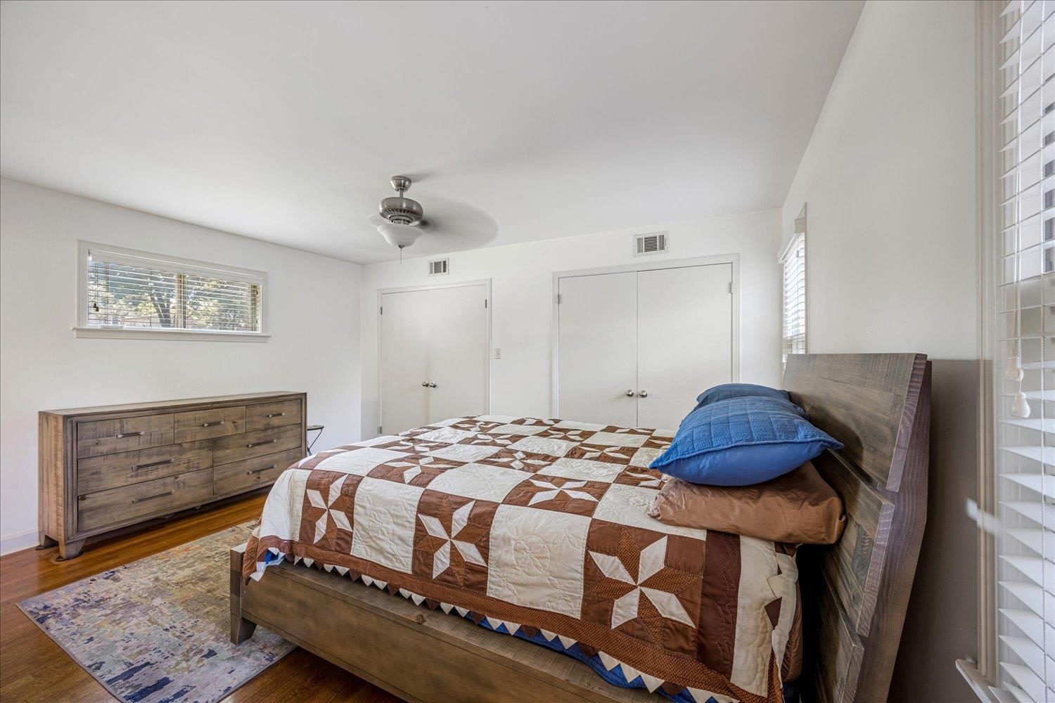 5323 Dee Road Memphis, TN 38117 - Photo 24 of 40 a bedroom with a bed a dresser and potted plant