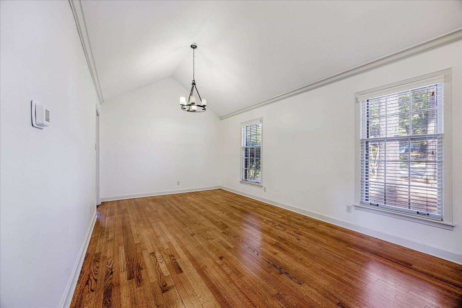 5323 Dee Road Memphis, TN 38117 - Photo 8 of 40 a view of empty room with wooden floor and fan