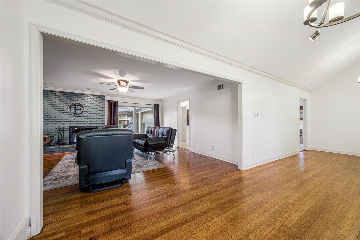 5323 Dee Road Memphis, TN 38117 - Photo 10 of 40 a view of livingroom and dining room with furniture wooden floor chandelier