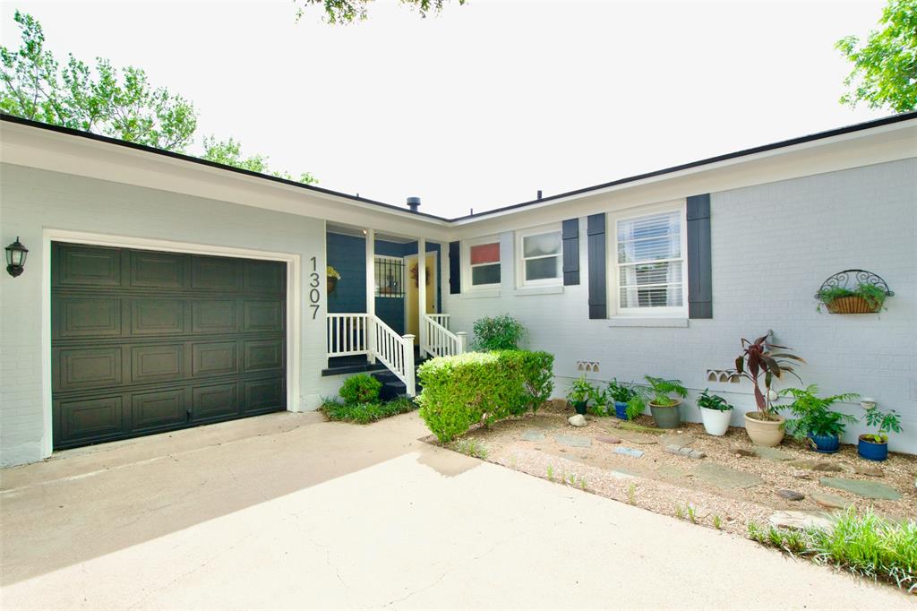 1307 North 65th Street Waco, TX 76710 - Photo 2 of 35 a front view of a house with garden