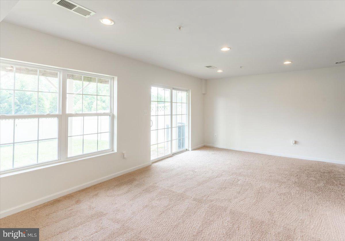 5327 Rockingham Place, Unit 75 White Plains, MD 20695 - Photo 18 of 21 lower level, back yard access and garage access.