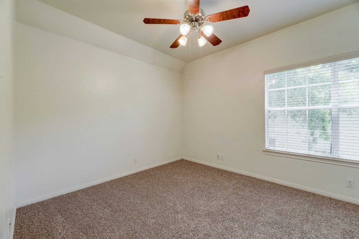 106 East 46th Street, Unit B Austin, TX 78751 - Photo 11 of 16 an empty room with a window and a fan