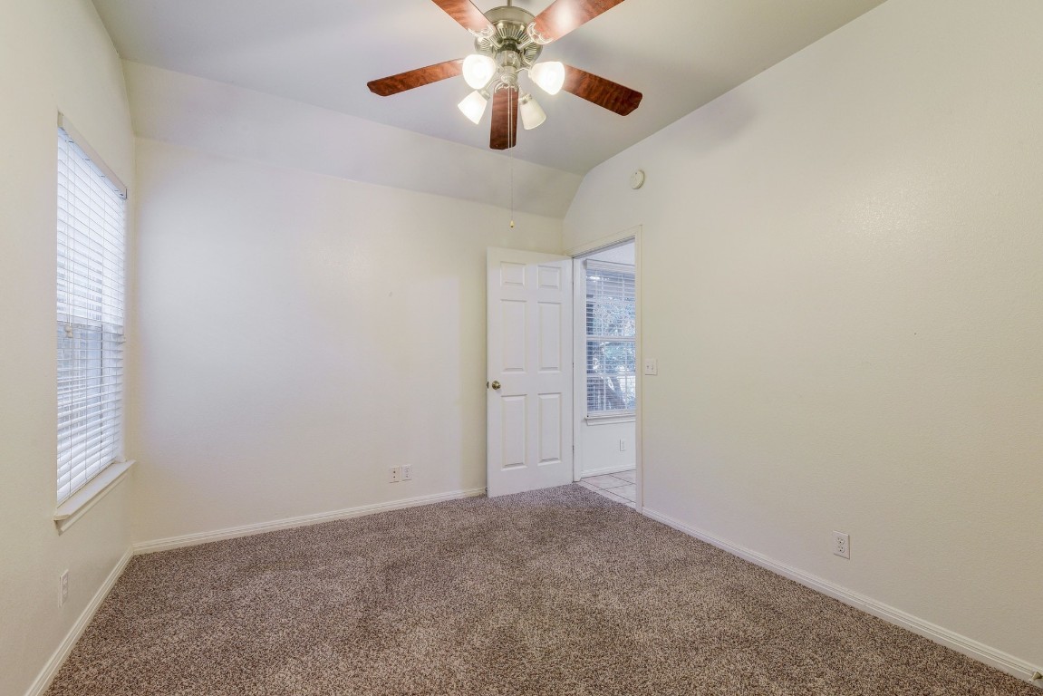 106 East 46th Street, Unit B Austin, TX 78751 - Photo 15 of 16 an empty room with windows and fan