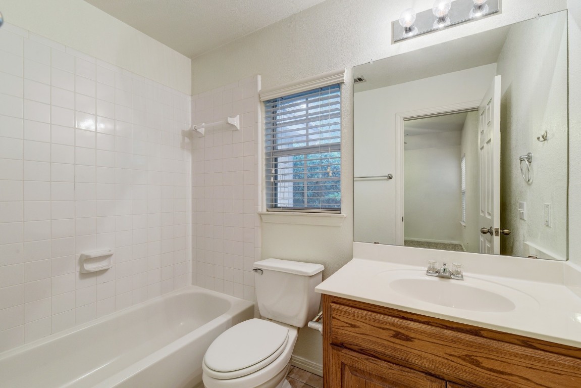 106 East 46th Street, Unit B Austin, TX 78751 - Photo 16 of 16 a bathroom with a sink a toilet and a bathtub
