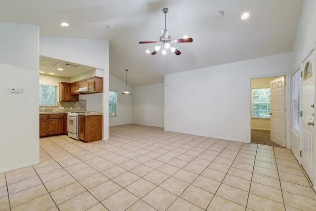 a view of a kitchen with a sink and cabinets