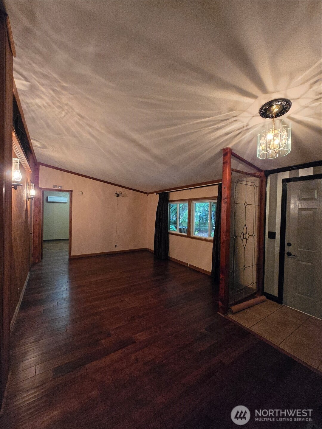 313 Minkler Road Winlock, WA 98596 - Photo 14 of 40 a view of a livingroom with wooden floor and a ceiling fan