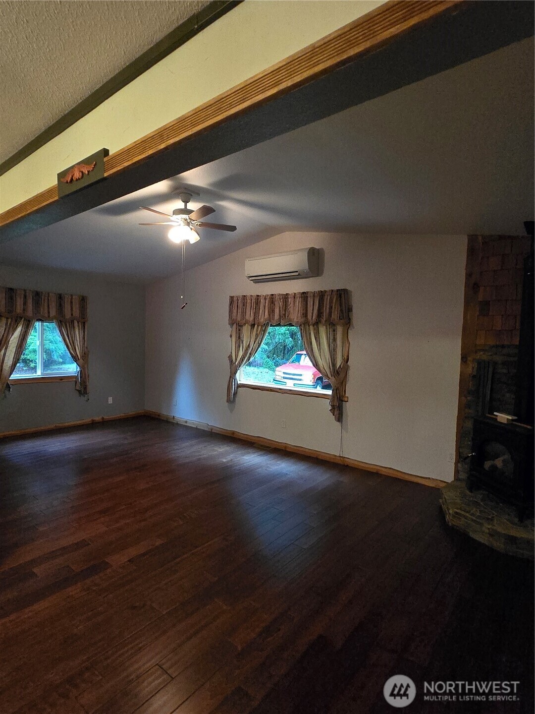 313 Minkler Road Winlock, WA 98596 - Photo 10 of 40 a view of an empty room with wooden floor and a window