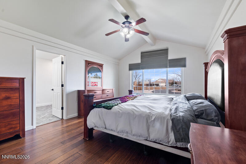 1060 Penelope Drive Fallon, NV 89406 - Photo 12 of 32 a bedroom with a bed and a chandelier