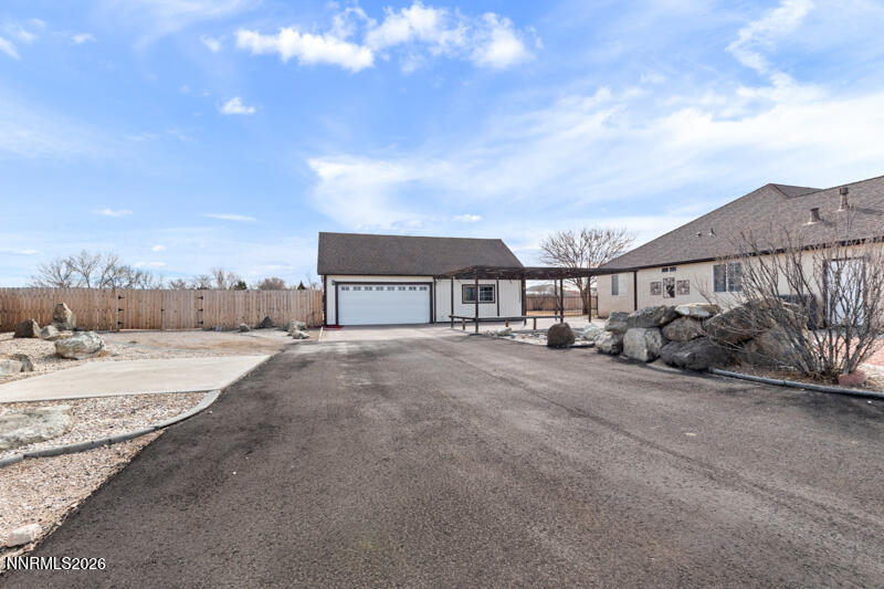 1060 Penelope Drive Fallon, NV 89406 - Photo 22 of 32 a view of a houses with snow on the road