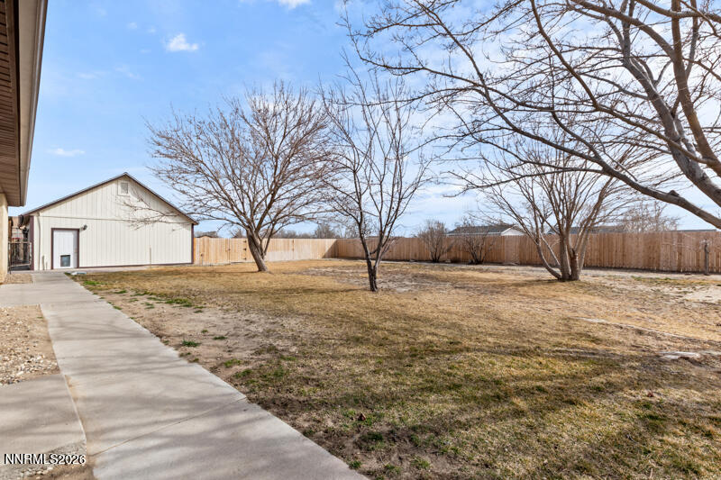 1060 Penelope Drive Fallon, NV 89406 - Photo 24 of 32 a view of a yard with trees