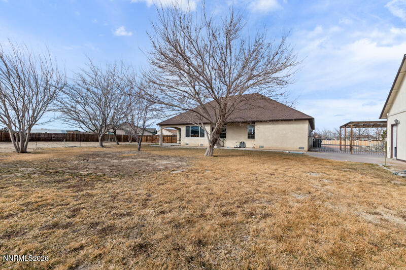 1060 Penelope Drive Fallon, NV 89406 - Photo 27 of 32 a front view of a house with a yard