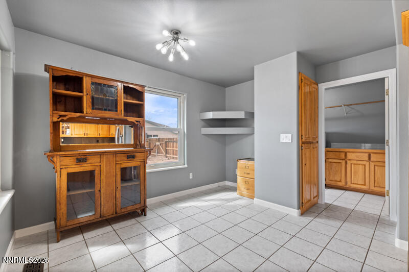 1060 Penelope Drive Fallon, NV 89406 - Photo 10 of 32 a kitchen with stainless steel appliances granite countertop a refrigerator and a stove top oven