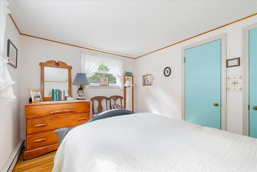 47 Beech Road Avon, MA 02322 - Photo 18 of 28 a bedroom with a bed and a large mirror on the dresser