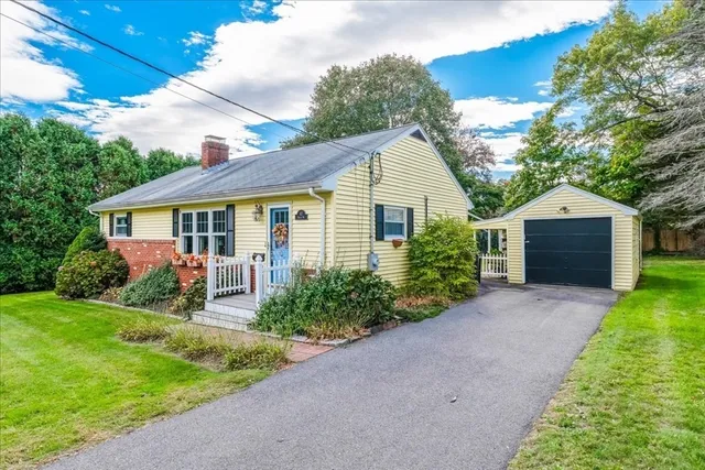a front view of house with yard and green space