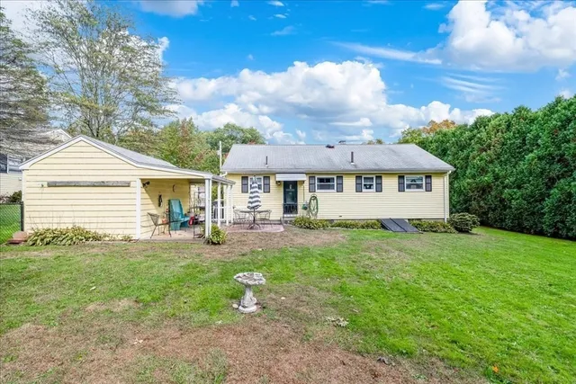 a patio with table and chairs