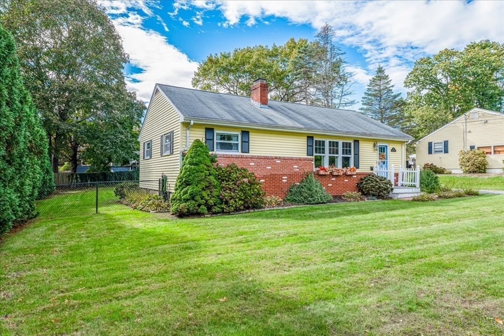 47 Beech Road Avon, MA 02322 - Photo 3 of 28 a front view of house with yard and green space