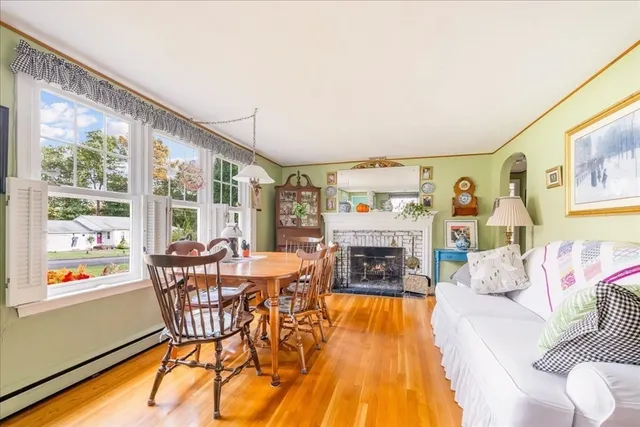a dining room with furniture and wooden floor