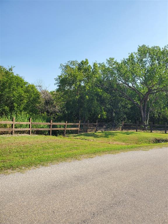 Tbd Hagerman Road Pottsboro, TX 75076 - Photo 4 of 5 a view of a house with a big yard and large trees