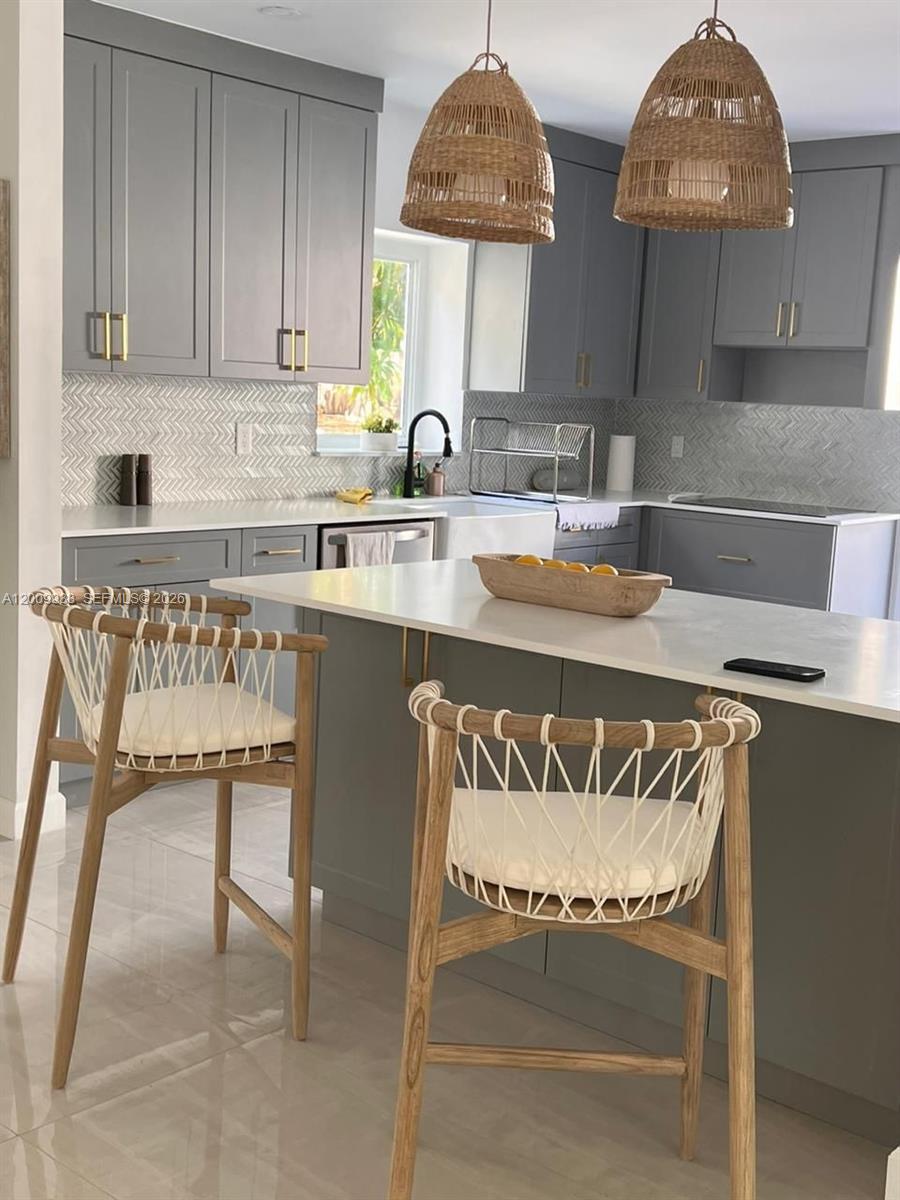 1030 Northeast 83rd Street Miami, FL 33138 - Photo 7 of 11 a kitchen with furniture and a stove