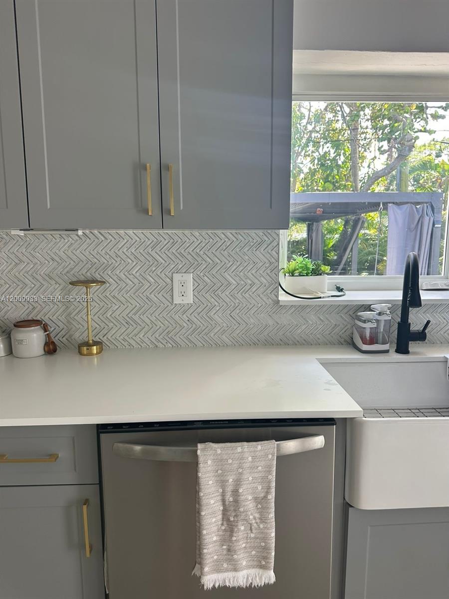 1030 Northeast 83rd Street Miami, FL 33138 - Photo 8 of 11 a bathroom with a sink and a window