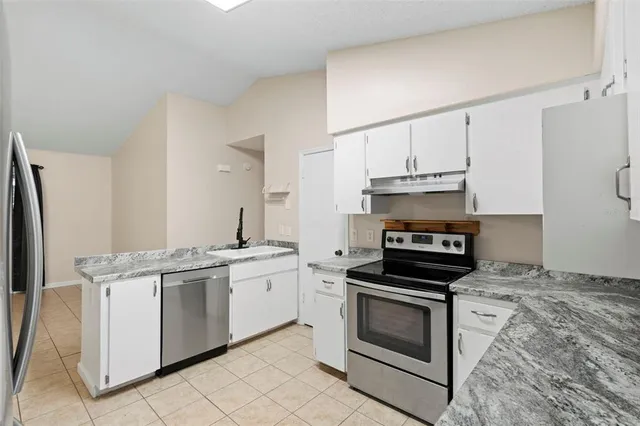 a bathroom with a sink toilet a mirror and shower
