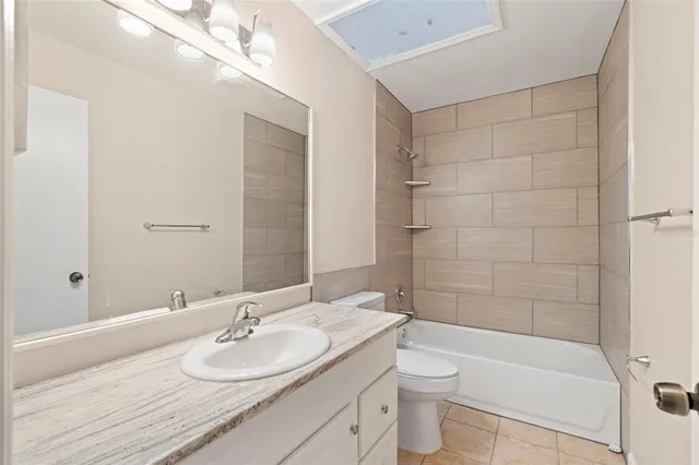 a view of a tree in front of a house