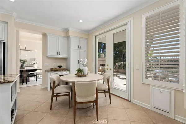 a spacious bathroom with a double vanity sink a mirror a window and a shower