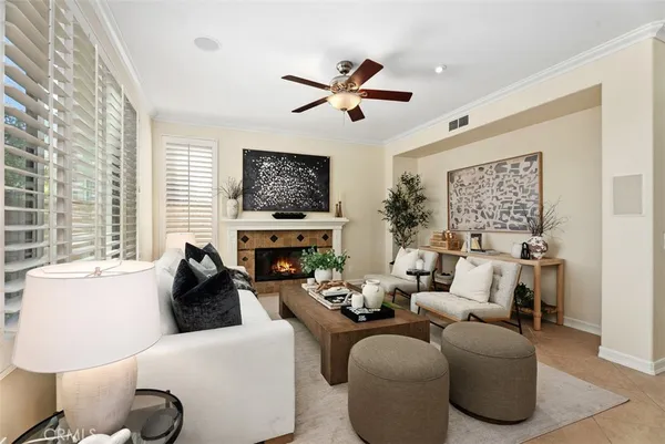 a view of a livingroom with furniture and a hallway