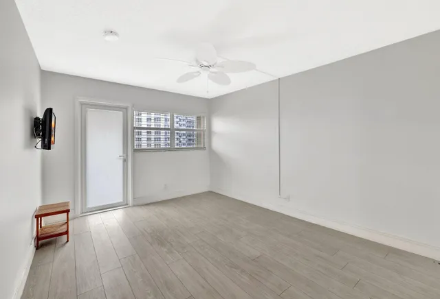 a bathroom with a sink a mirror a toilet and shower