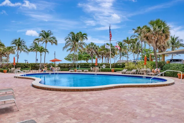 a view of a patio with couches and a fire pit