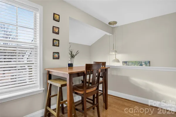 a view of a dining room with furniture and window
