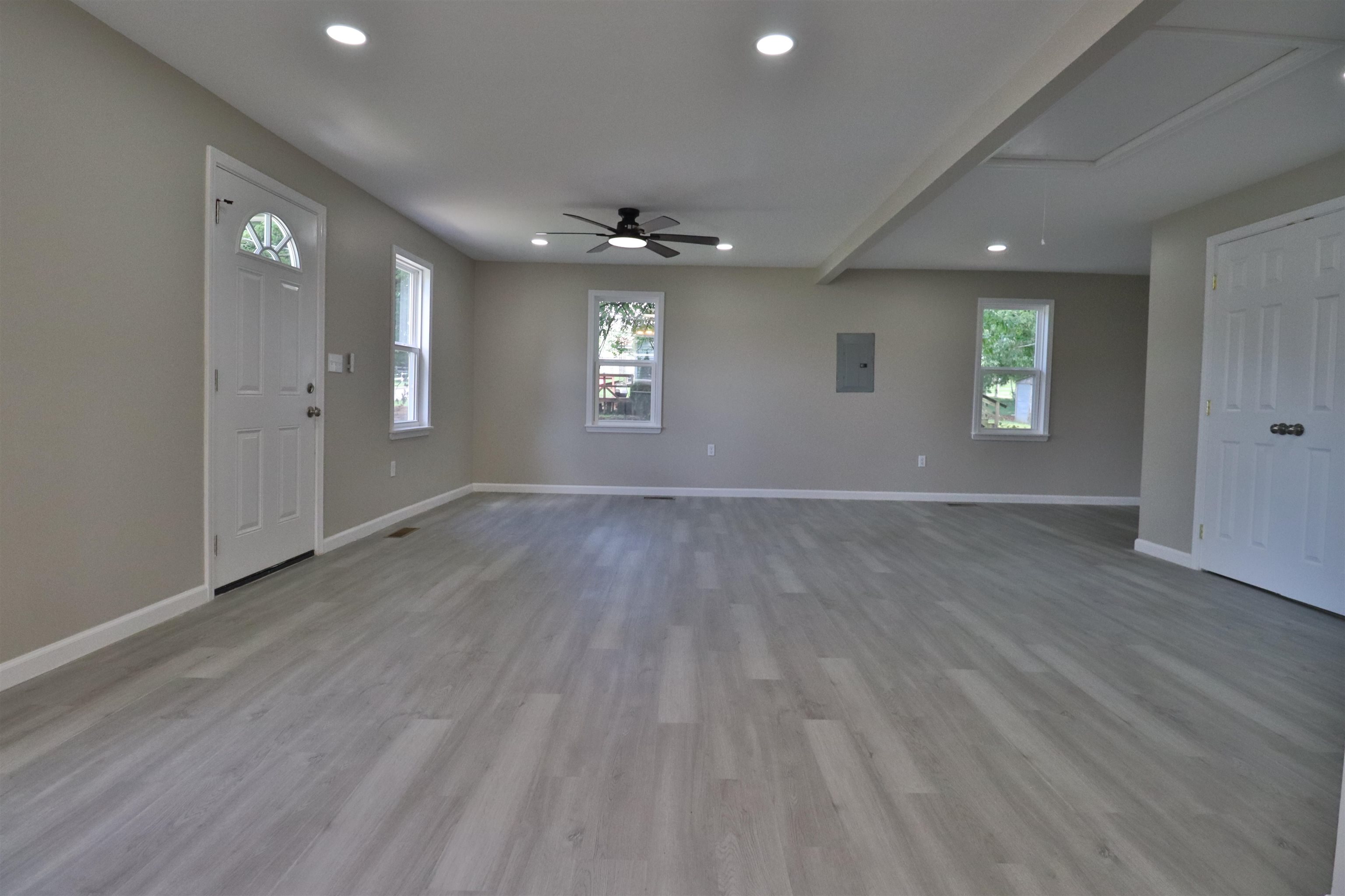 224 Kellar Avenue Ripley, TN 38063 - Photo 3 of 30 an empty room with wooden floor and windows