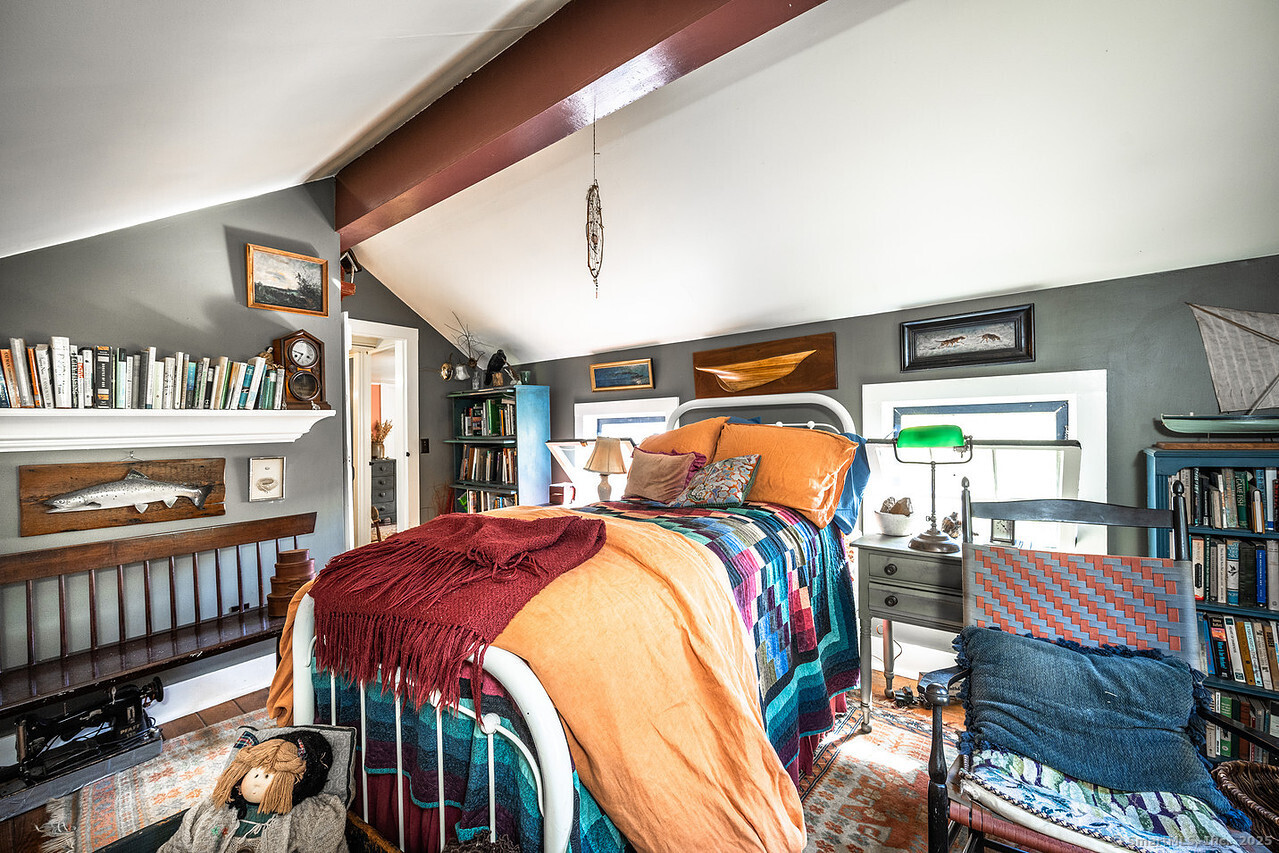 143 Whitcomb Hill Road Cornwall, CT 06754 - Photo 26 of 40 a bedroom with two beds and a book shelf