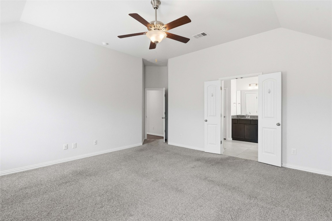 22020 Abigail Way Pflugerville, TX 78660 - Photo 14 of 25 an empty room with a ceiling fan and a window