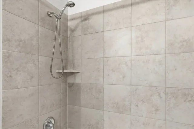 a bathroom with a granite countertop sink a toilet and a mirror
