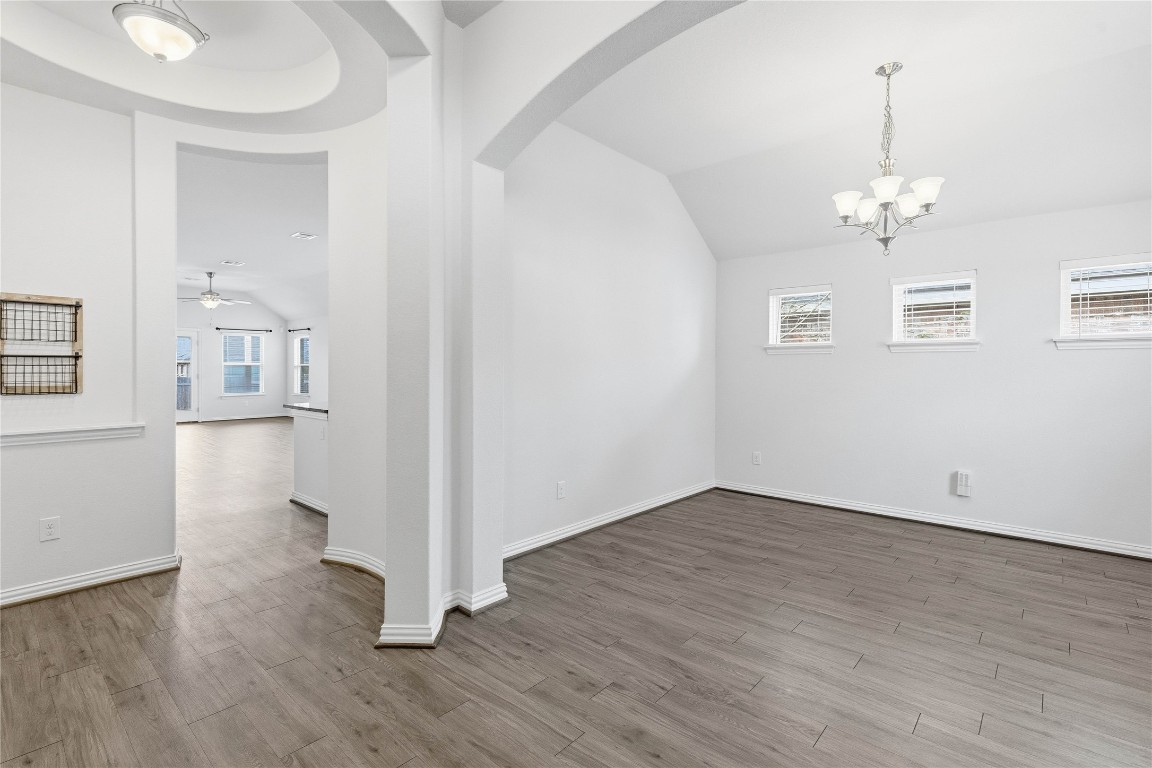 22020 Abigail Way Pflugerville, TX 78660 - Photo 4 of 25 an empty room with wooden floor and windows