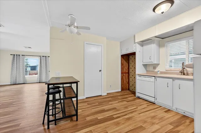 a kitchen with a table and chairs
